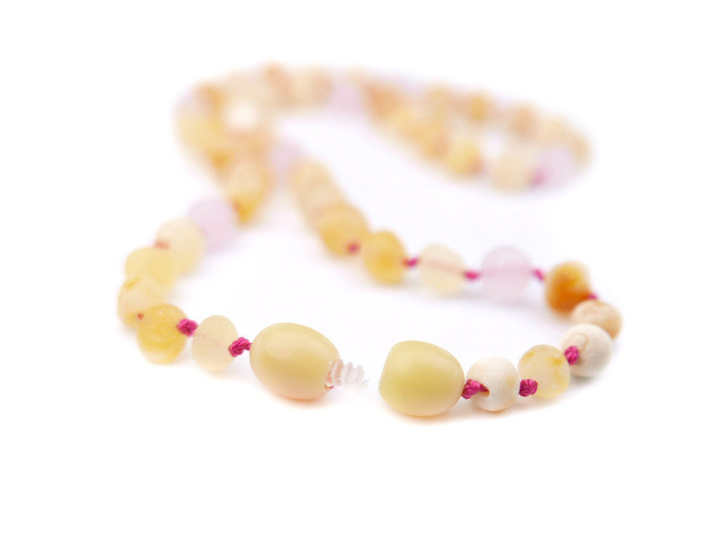 Handcrafted baby raw amber teething necklace with natural butterscotch nuggets and rose quartz accents
