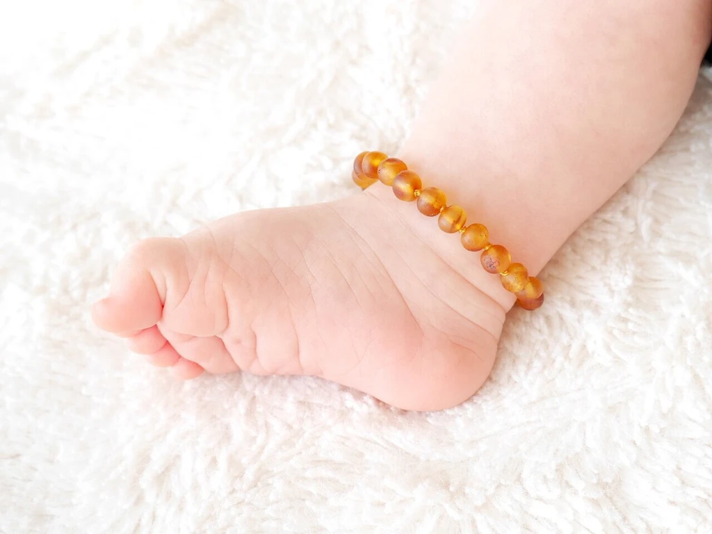 Genuine certified Baltic amber teething bracelet with natural raw honey rounded beads