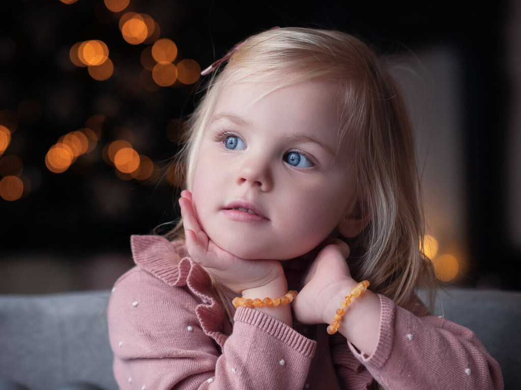 Raw unpolished honey Baltic amber bracelet or anklet for children in traditional teething-style design 