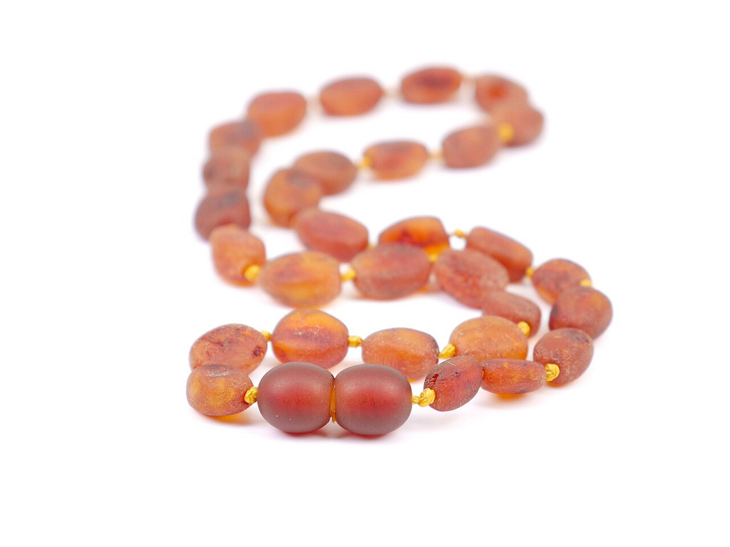 Lightweight raw amber teething necklace in cognac tones with individually knotted beads 
