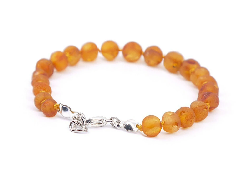 Adjustable raw Baltic amber teething bracelet with natural honey amber tones for kids 