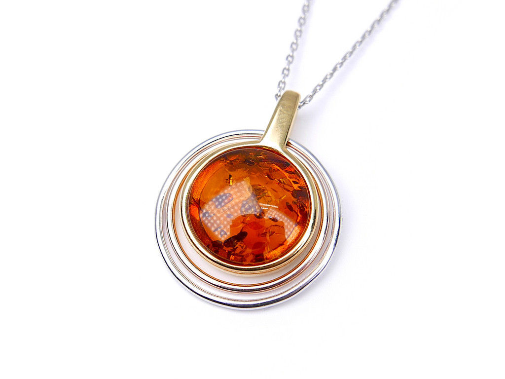 Gold plated two-tone circle orbital amber pendant
