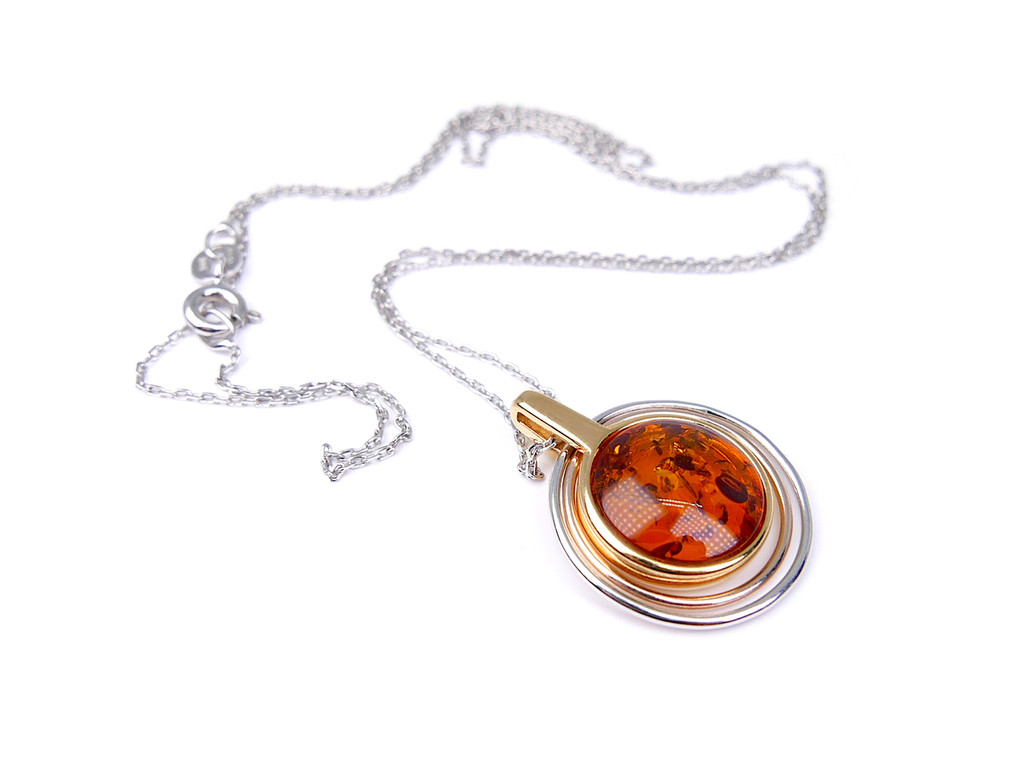Gold plated two-tone circle orbital amber pendant