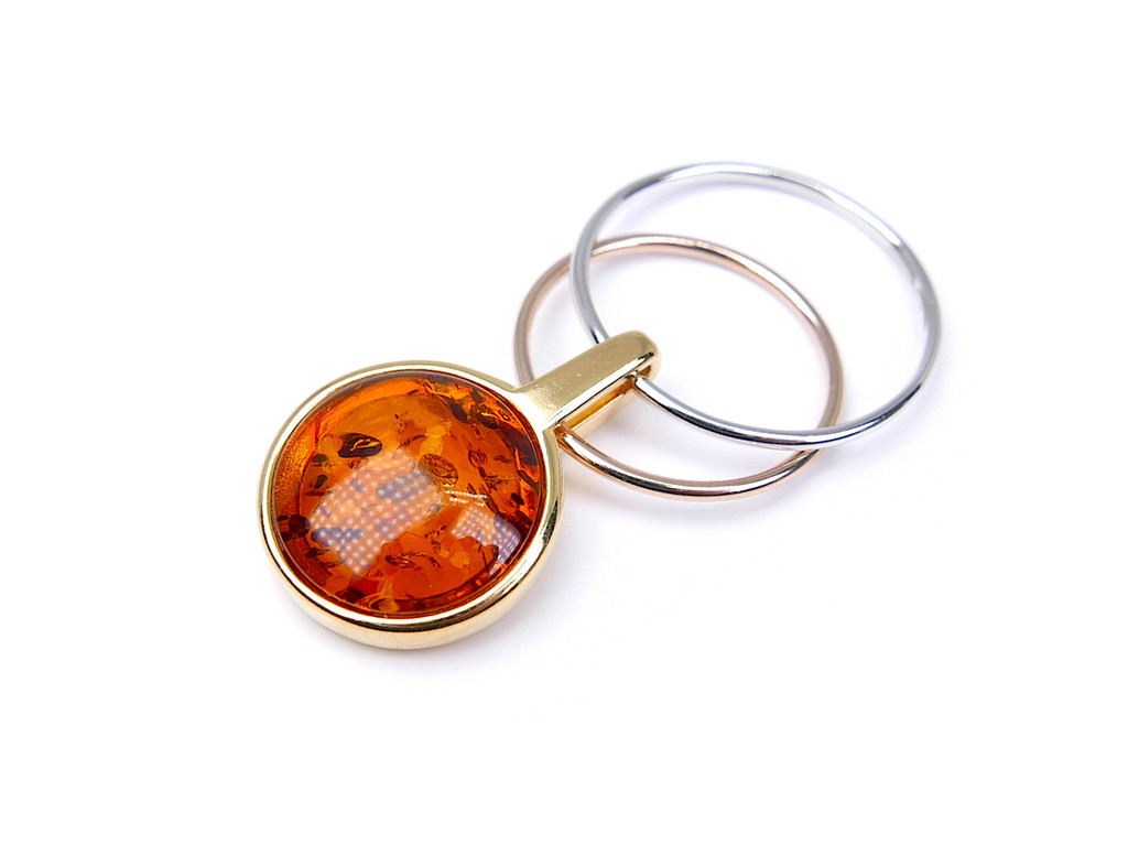 Gold plated two-tone circle orbital amber pendant