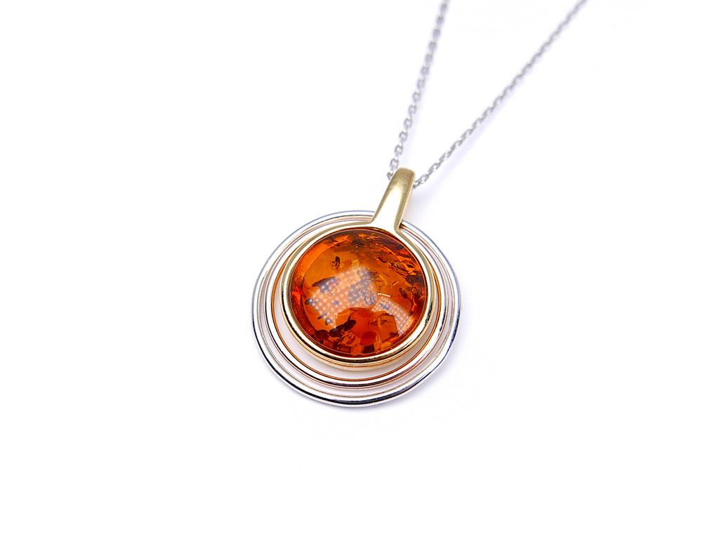 Gold plated two-tone circle orbital amber pendant