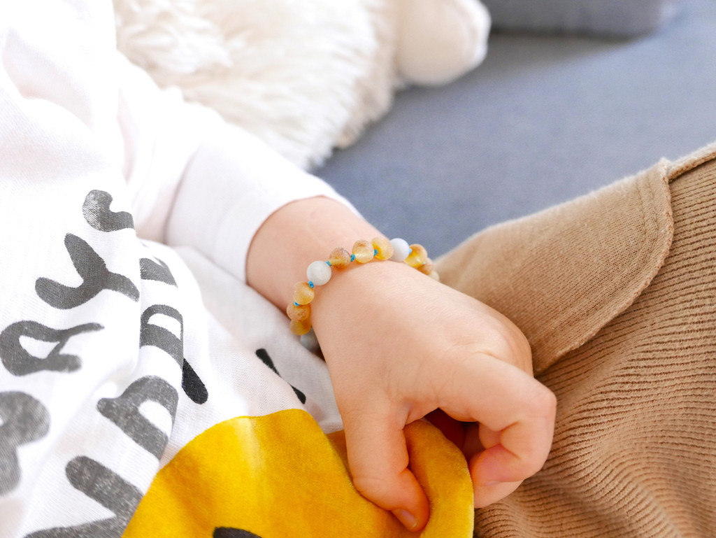 Baltic amber jewellery for children with natural matte aquamarine gemstones and screw clasp - traditional teething style design