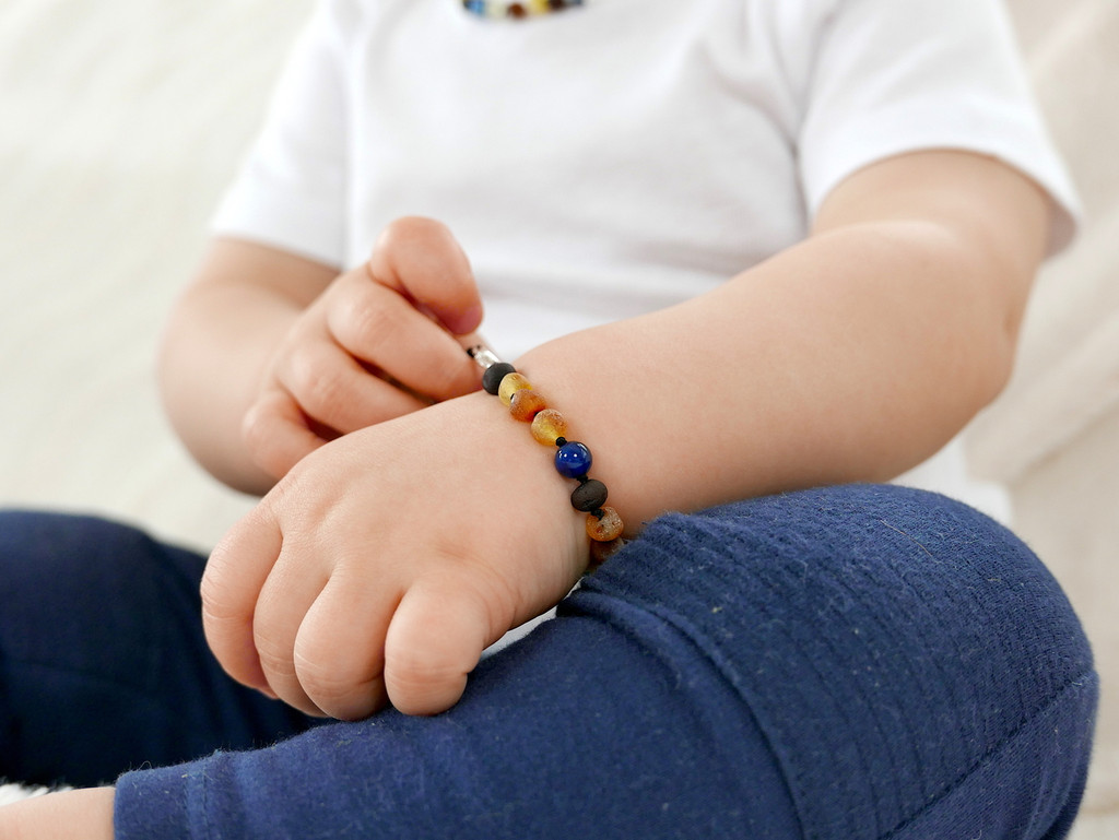 Handmade Baltic amber teething bracelet with multicoloured beads durable double-knotted design and secure clasp