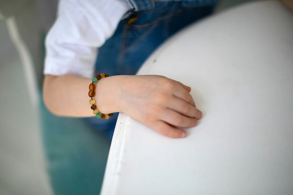 Multicoloured raw amber teething bracelet with genuine matte green agate stones and secure screw clasp certified Baltic amber jewellery