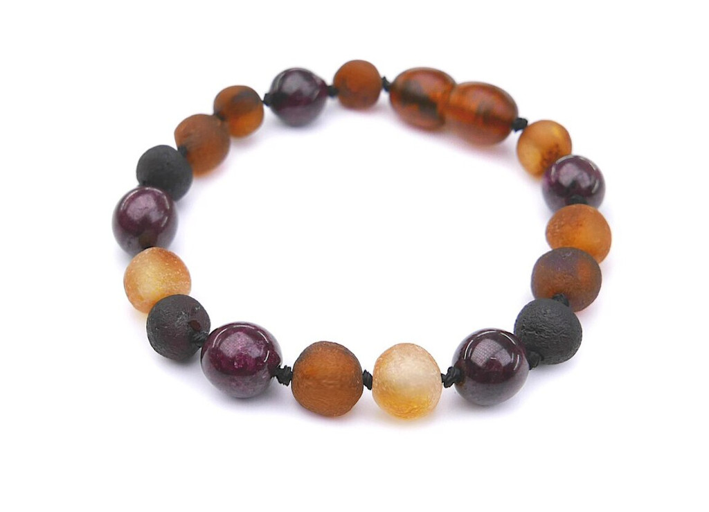 Adjustable amber bracelet for kids crafted from untreated amber nuggets and deep red garnet stones earthy Baltic design