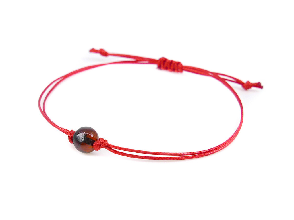 Red string bracelet with dark cherry amber