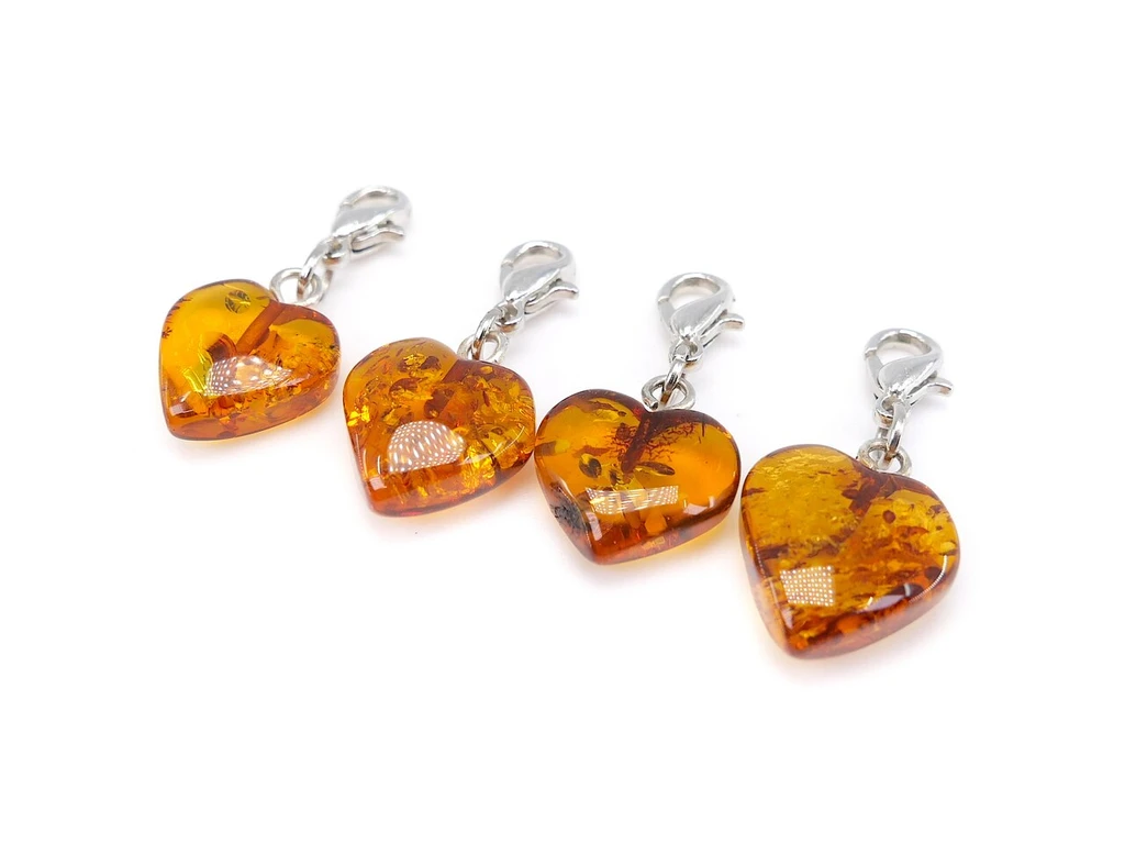 Genuine Baltic Amber Heart Charm Pendant – Beautiful hand-carved heart-shaped pendant made from 100% natural Baltic amber, featuring a silver-tone lobster clasp for attaching to compatible adult & kids amber jewellery