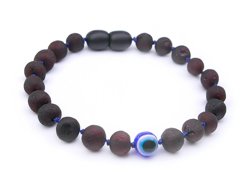Authentic raw Baltic amber teething bracelet for children with blue Evil Eye charm natural unpolished amber beads and secure screw clasp