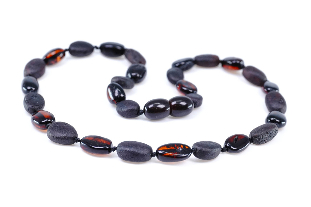 Earthy raw-style Baltic amber teething necklace for children with deep dark cherry and black oval beads