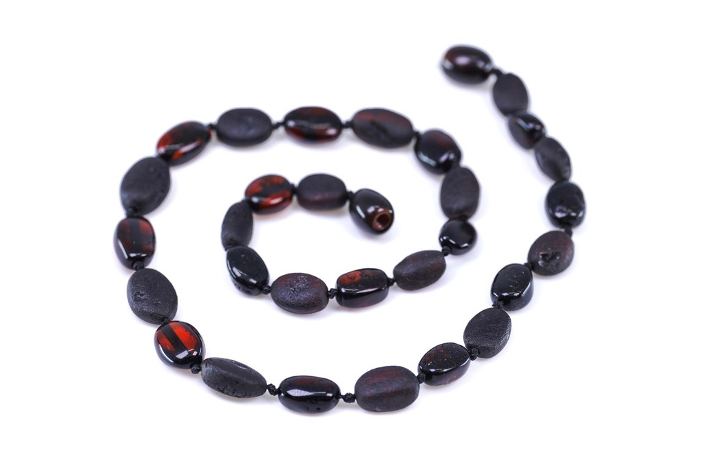 Natural raw Baltic amber teething necklace in dark cherry and black tones with secure screw clasp for children