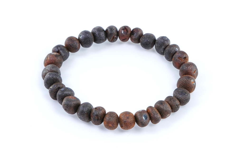 Eco-friendly children’s stretch amber teething anklet made from raw dark cherry Baltic amber beads, polished for comfort and natural beauty 