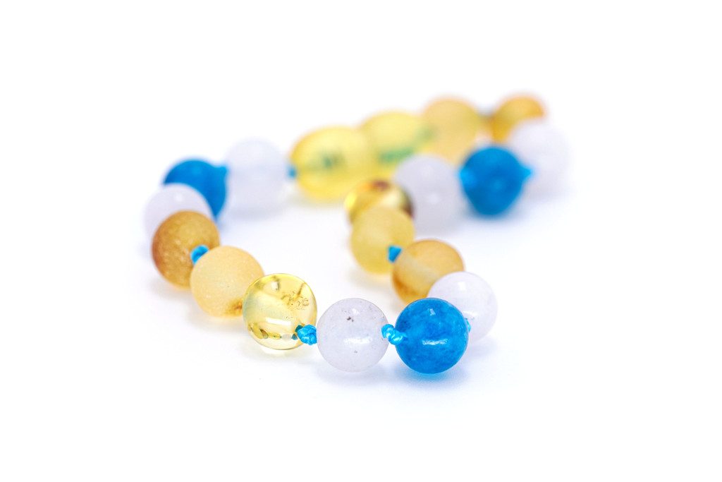 Handcrafted organic amber teething anklet with mixed baroque beads and calming blue Aquamarine and Apatite tones, Baltic artisan jewellery 
