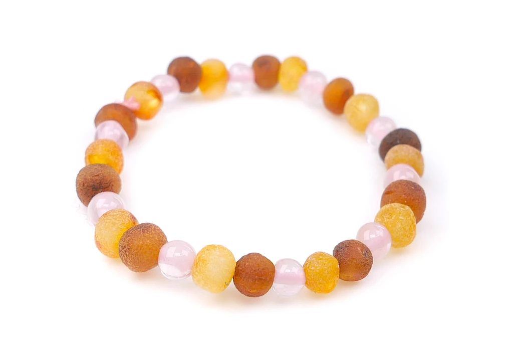 Small handmade Baltic amber anklet with natural rose quartz gemstones and elastic cord in newborn girls' size
