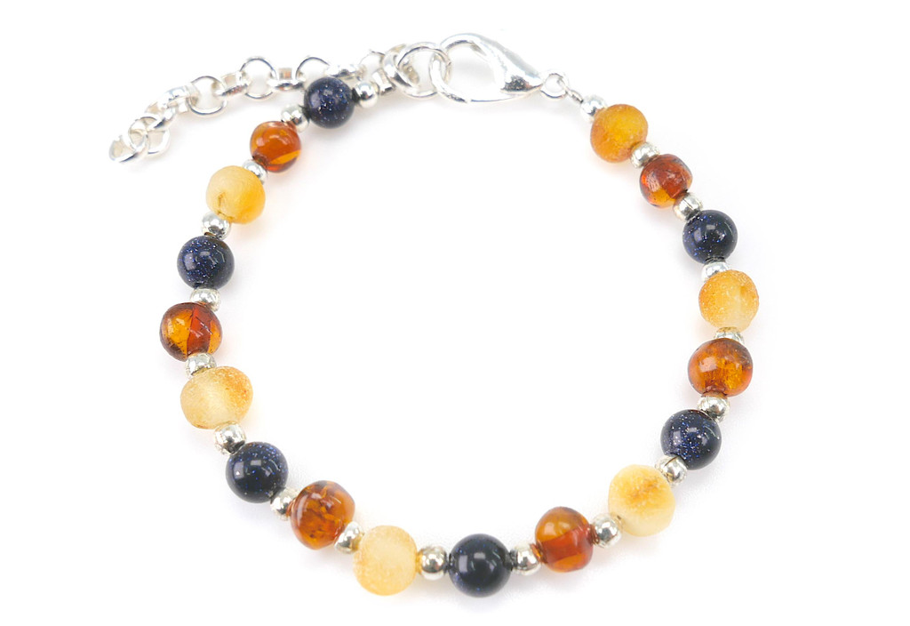 Handmade Baltic amber teething style bracelet featuring natural unpolished amber and dark blue sandstone