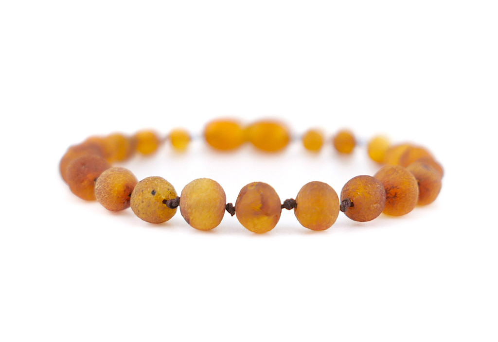 Raw Cognac Baltic Amber Teething Jewellery Showing Natural Amber Texture, Rounded Baroque Beads and Hand-Knotted Details
