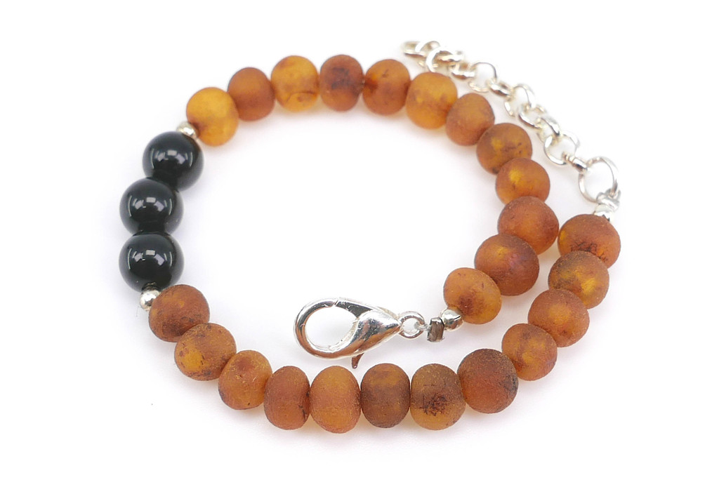 Raw Caramel Baltic Amber and Natural Black Onyx Beads – Detailed View of Authentic Unpolished Baltic Amber, Unique Baroque Bead Shapes, Natural Textures and Polished Black Onyx Gemstones