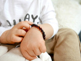 Authentic Baltic amber teething bracelet with double-knotted dark cherry beads 