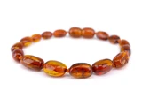 Amber teething bracelet or anklet for babies, cognac olive polished beads