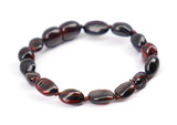 Polished Baltic amber teething bracelet in dark cherry – available Ireland 
