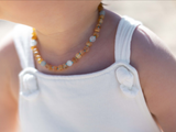 Amber teething set with matte aquamarine