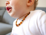 Natural Baltic amber teething necklace with raw earthy beads and secure screw clasp