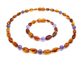 Amber teething set with amethyst