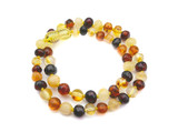 Premium multicoloured polished Baltic amber teething necklace with rounded baroque beads for kids and babies