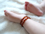 Handcrafted cognac amber teething necklace for children made from polished Baltic beads