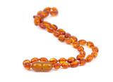 Rounded polished Baltic teething amber bead necklace in cognac colour for kids