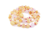 Certified Baltic amber teething necklace for kids with raw butterscotch beads and matte rose quartz highlights