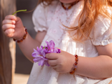 Baltic amber jewellery UK online. Natural amethyst amber teething bracelet for 1 year old