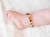 Multicoloured Baltic amber anklet for teething with rounded baroque beads – handmade and safely knotted