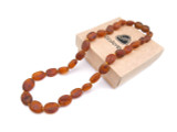 Raw cognac Baltic amber teething necklace with natural olive-shaped beads 