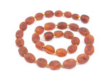 Teething Baltic amber necklace made with individually knotted raw cognac beads