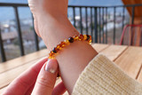 Adult amber bracelet for men and women featuring multicoloured Baltic amber baroque beads — handmade natural jewellery