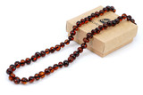 Certified Baltic amber necklace for adults with dark cherry and black beads — genuine handmade jewellery from the Baltic States, ships worldwide