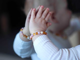 Handcrafted Baltic amber teething bracelet featuring baroque amber and Chalcedony beads