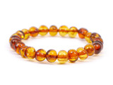 Stretch light cognac amber teething anklet for babies handcrafted with baroque beads 