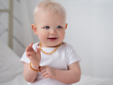 Children’s multicoloured honey raw Baltic amber necklace and bracelet teething set featuring natural olive beads