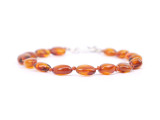 Handmade adjustable cognac and olive Baltic amber teething bracelet or anklet – authentic jewellery available in the UK & Ireland