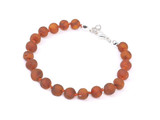 child size adjustable raw amber bracelet in caramel tone with secure clasp - traditional teething style design