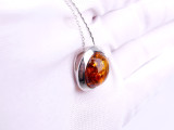 Baltic amber round moon shape silver pendant