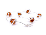 Baltic amber spheres bracelet in sterling silver