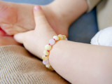 Baltic amber teething jewellery for children with rose quartz gemstone details handcrafted from genuine amber nuggets