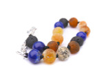 Multicolour amber and blue agate kids teething bracelet crafted from 100 % natural raw amber handmade in the Baltic States