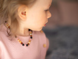 Pink amber teething necklace